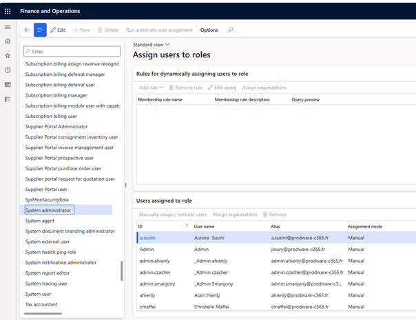 Screenshot of a user interface for assigning roles in a Finance and Operations application, featuring a list of users, their roles, and options for dynamic role assignment.